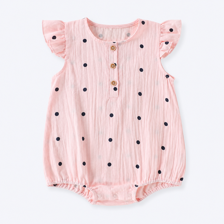 Blush pink baby girl polka dot ruffle sleeve cotton bodysuit on a pale blue-gray background