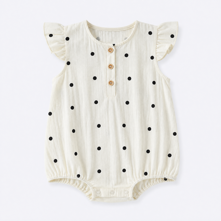 Cream baby girl polka dot ruffle sleeve cotton bodysuit on a pale blue-gray background