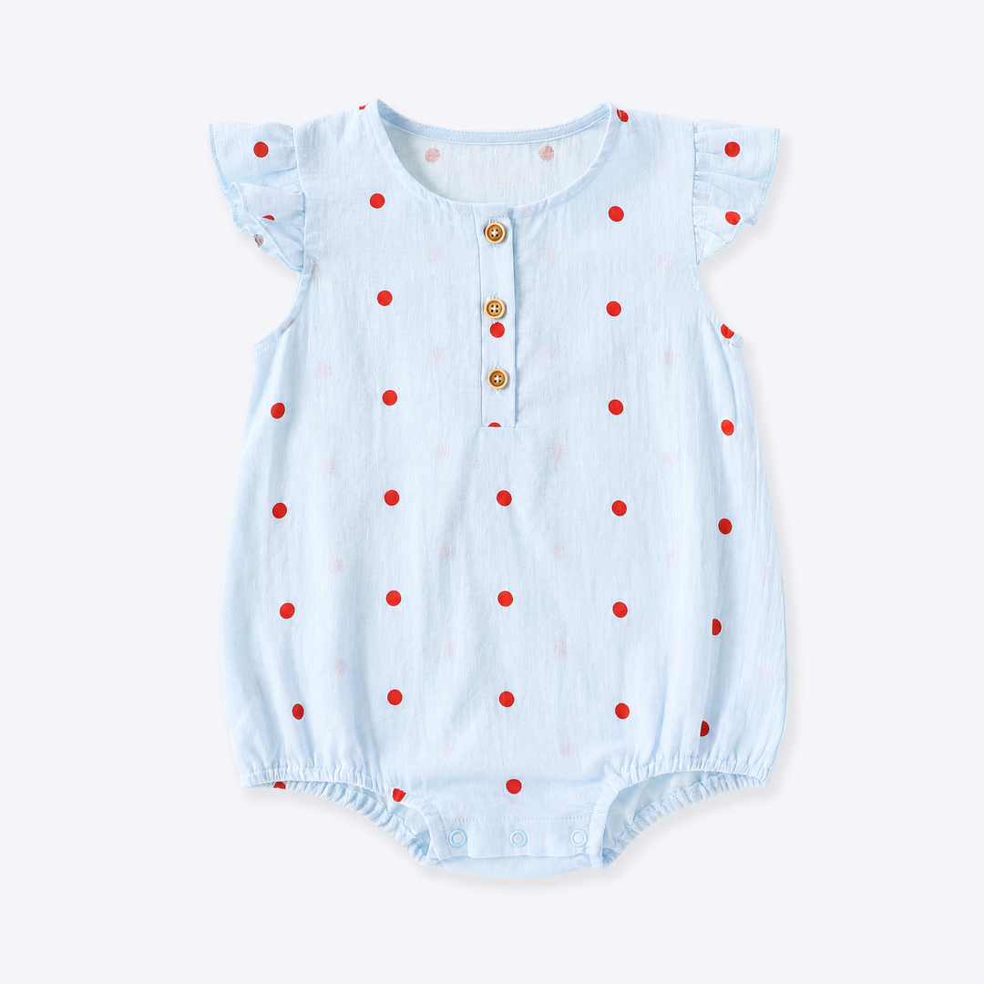 Sky blue baby girl polka dot ruffle sleeve cotton bodysuit on a pale blue-gray background