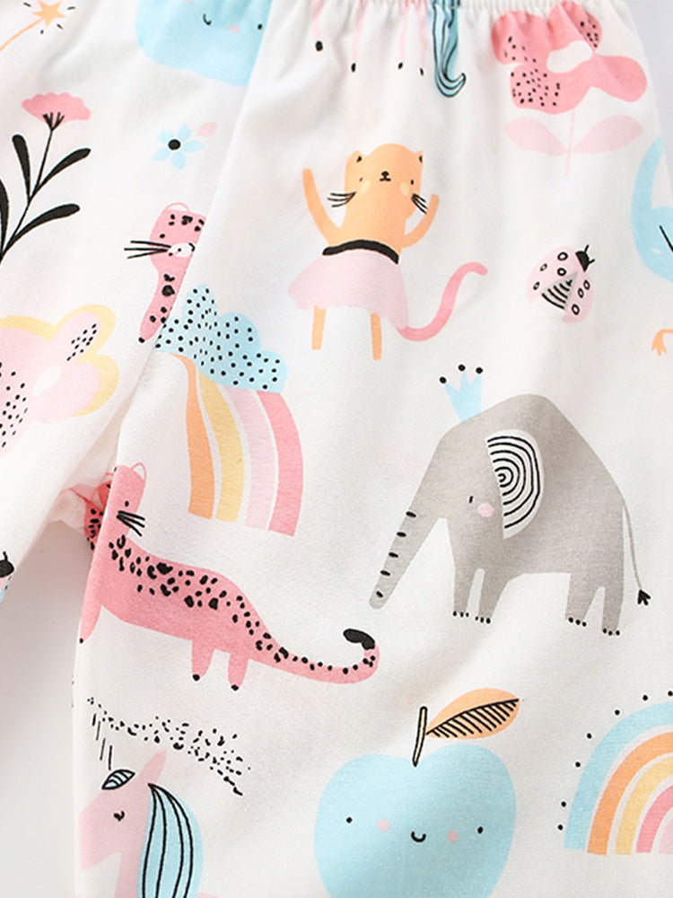 Close-up of pastel rainbow and safari animal print on Girls’ cotton pajama set