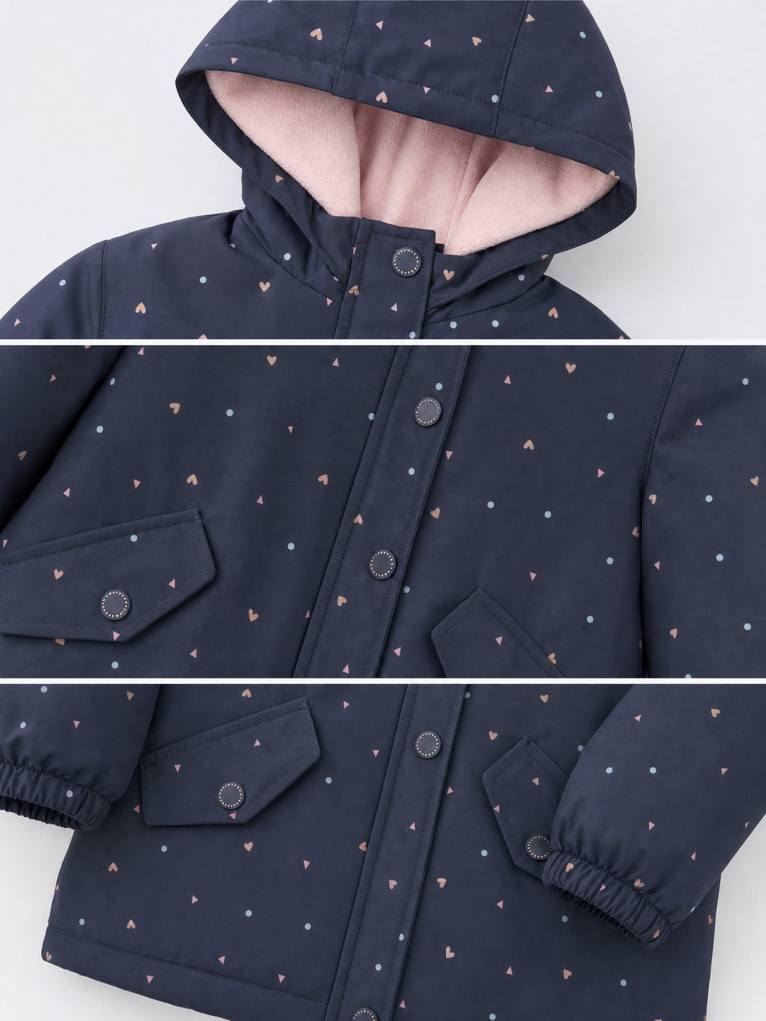 Close-up details of girls navy heart print hooded jacket with pink lining, covered zip and flap pockets