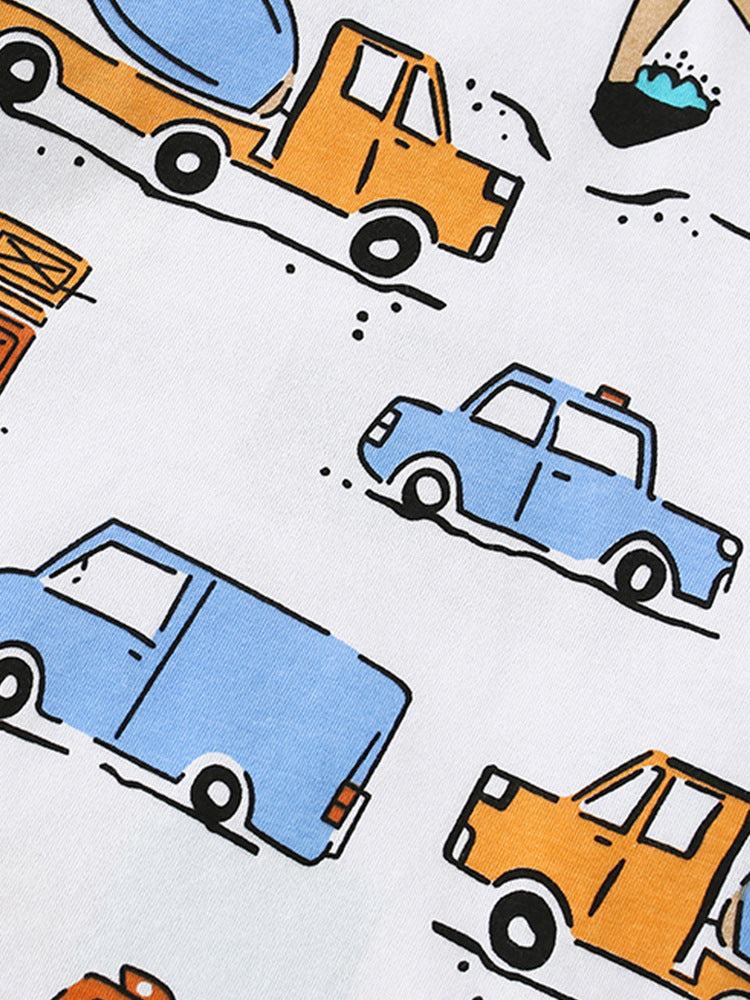Close-up of blue, orange and turquoise city vehicle print on Kids’ cotton pajama set